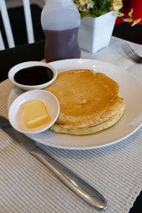 pancake serving with chocolate sauce and butter