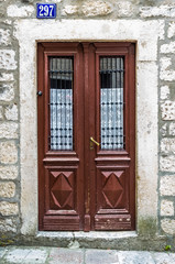 Fototapeta na wymiar Brown wooden door in old house