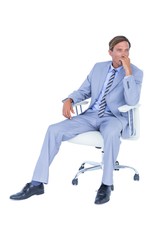  Handsome businessman sitting on a swivel chair