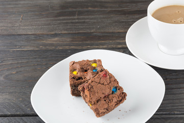 brownies in plate on wood table