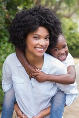 Happy african american mother and daughter having fun together