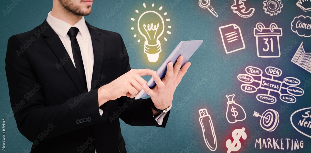 Poster composite image of mid section of a businessman using a tablet