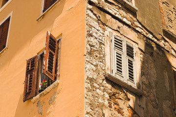 Old building facade. One is new, the other is old.