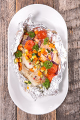 fish and vegetable cooked in paper