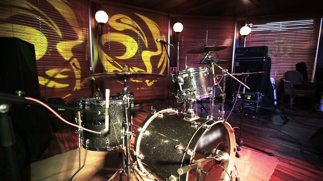 Drum set, microphones and cymbals no people. Wide angle lens.