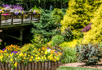 Flowers and Evergreens by Bridge