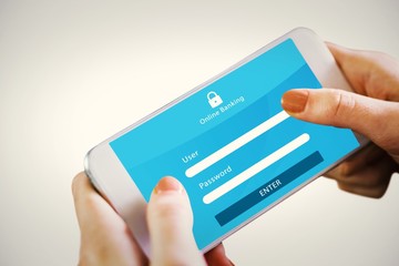 Composite image of hand holding smartphone