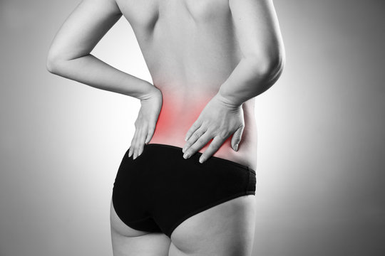 Woman with backache. Pain in the human body