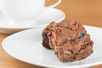 brownies in plate on wood table