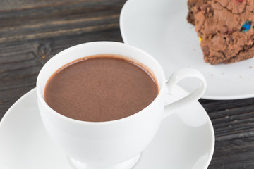 a cup of chocolate with brownie