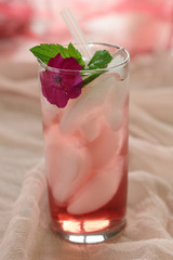Glass of freshly prepared, cold and refreshing pomegranate drink.