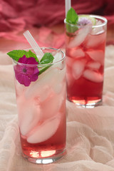 Glass of freshly prepared, cold and refreshing pomegranate drink.