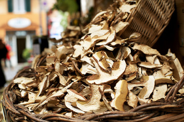 White mushrooms spilling out of wicker baskets