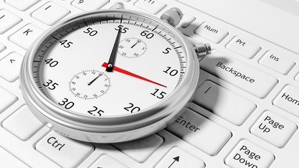 Fototapeta premium Silver chronometer white laptop keyboard