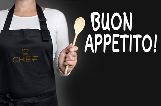 buon appetito cook holding wooden spoon background
