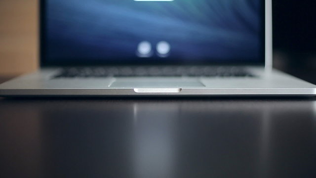 Hand open modern laptop