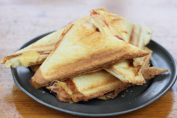 Triangle cheese and ham toasted sandwiches.