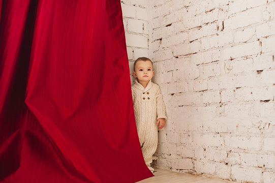 Little Kid Hiding Behind A Curtain