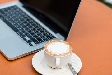 Woman hands typing on laptop