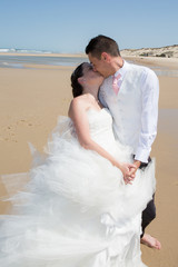 Fototapeta na wymiar Beautiful couple at the beach happy together