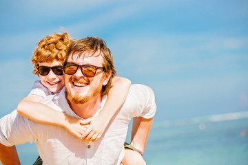 Hipster father with beard and red haired son having happy summer