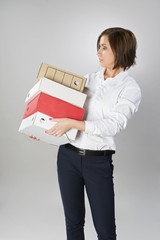 secretary woman with a large stack of folders