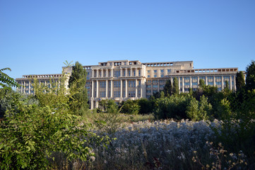 Fototapeta na wymiar Bucharest, Romania: Unfinished and overgrown building of the Romanian Academy (Academia Romana)
