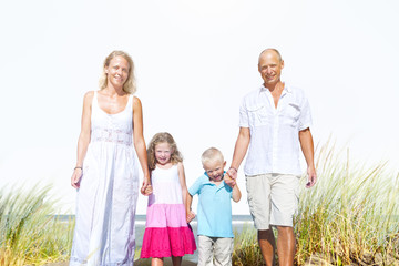 Naklejka premium Family Walking Playful Vacation Travel Holiday Concept