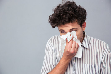 Man blowing his nose