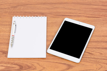 White digital Tablet on wooden