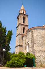 Fototapeta na wymiar Catholic church exterior, bell tower. Sartene