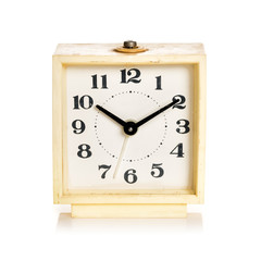 Old alarm clock on a white background