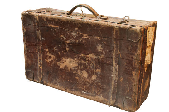 Old used weathered vintage grunge suitcase isolated on white background
