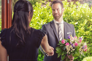 Handsome Guy Gives Fresh Flowers to his Girlfriend