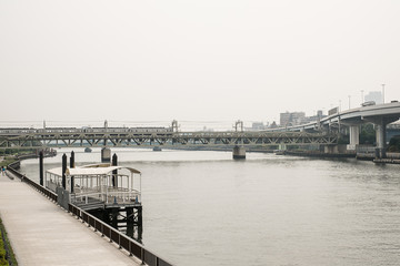 Fototapeta na wymiar The train across a river in japan, sepia tone effect