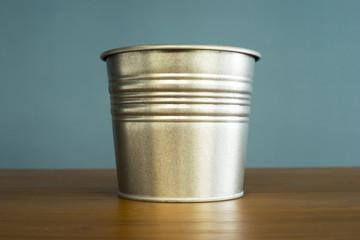 Zinc bucket on table