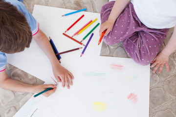 brother and sister drawing pictures