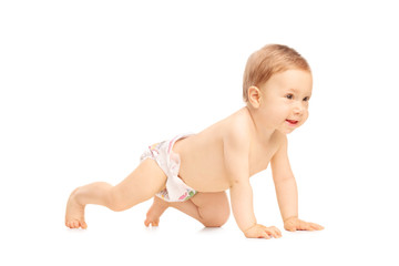 Adorable little baby girl crawling on the floor