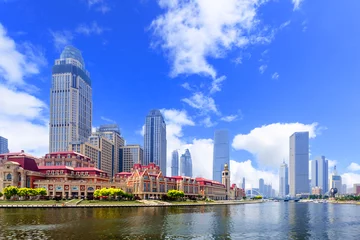 Foto op Plexiglas modern buildings in urban city at riverbank © zhu difeng