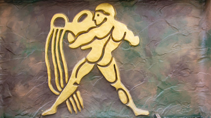 Aquarius sign of horoscope on the wall