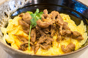 pepper pork fried with rice and omelet, selective focus point