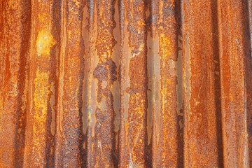 Aged rusty corrugated metal sheet