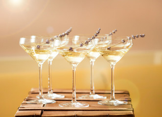 Glasses of white pink champagne decorated with lavender