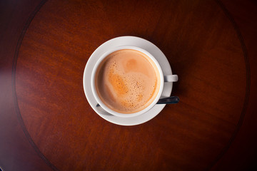 cup of coffee  in wooden background