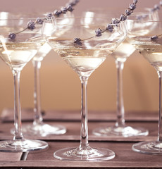 Glasses of white pink champagne decorated with lavender