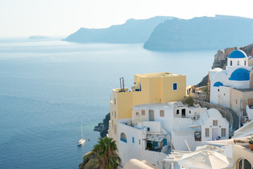 Panorama of traditional terraced houses in Oia, Santorini