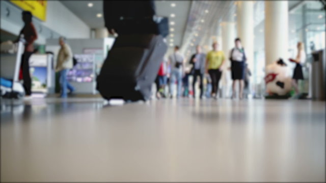 Movement of people at the airport. Blurred background