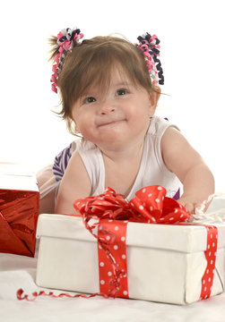 Cute baby girl  with gifts