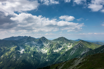 Fototapeta premium Amazing summer mountains under blue sky with clouds