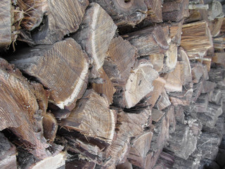 A pile of irregularly stacked pieces of firewood
